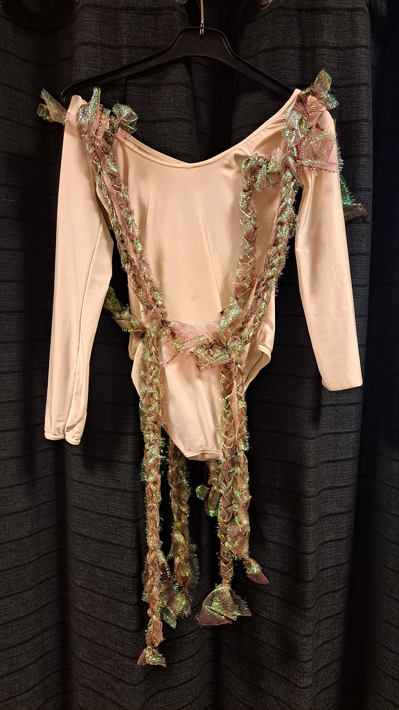 Witte top met glimmend hesje