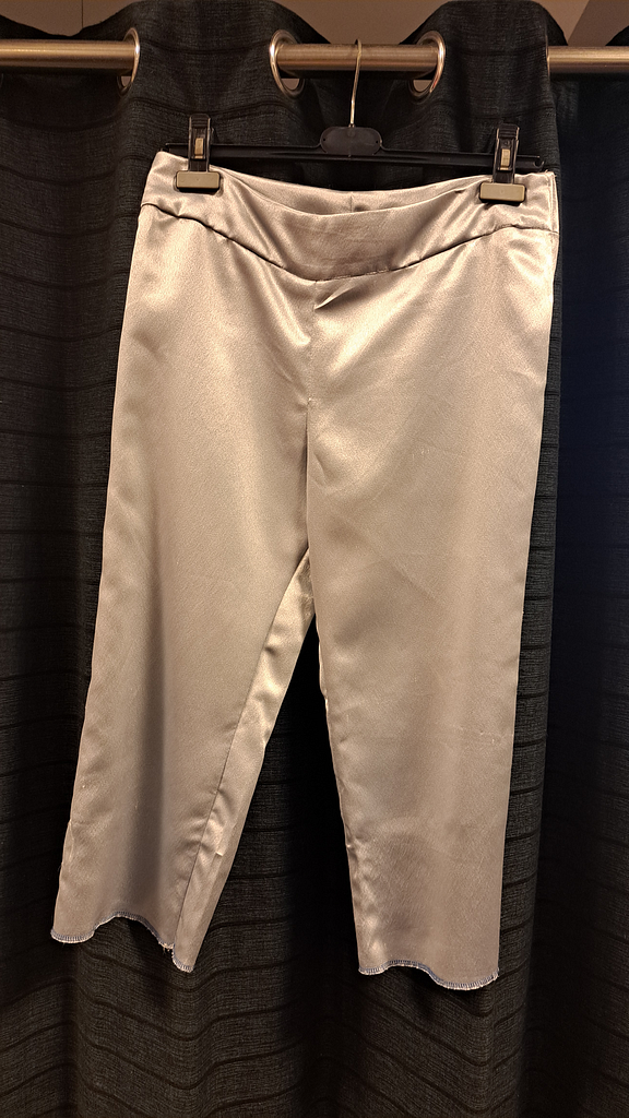 Grijze glimmende broek