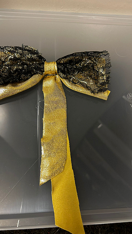 Haar strik goud zwart